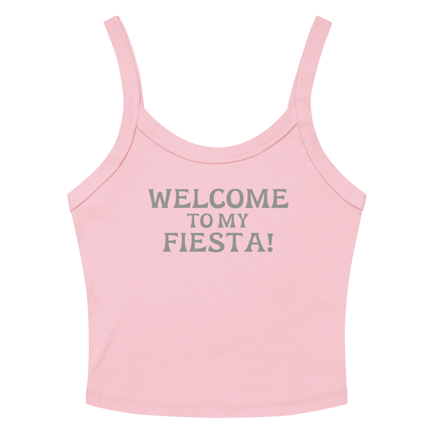 "Welcome to my fiesta!" printed on a solid pink blend women's micro-rib tanktop laying on a flat surface amongst sunglasses and shorts