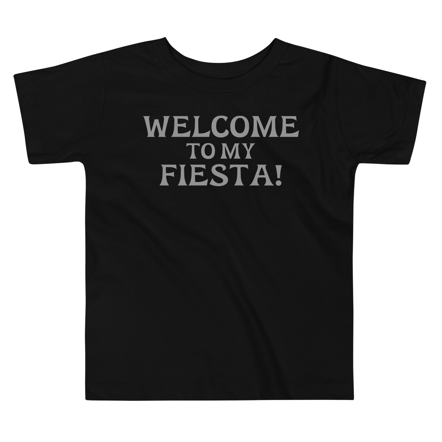 "Welcome to my fiesta!" printed on a black toddler short sleeve tee laying on a flat surface