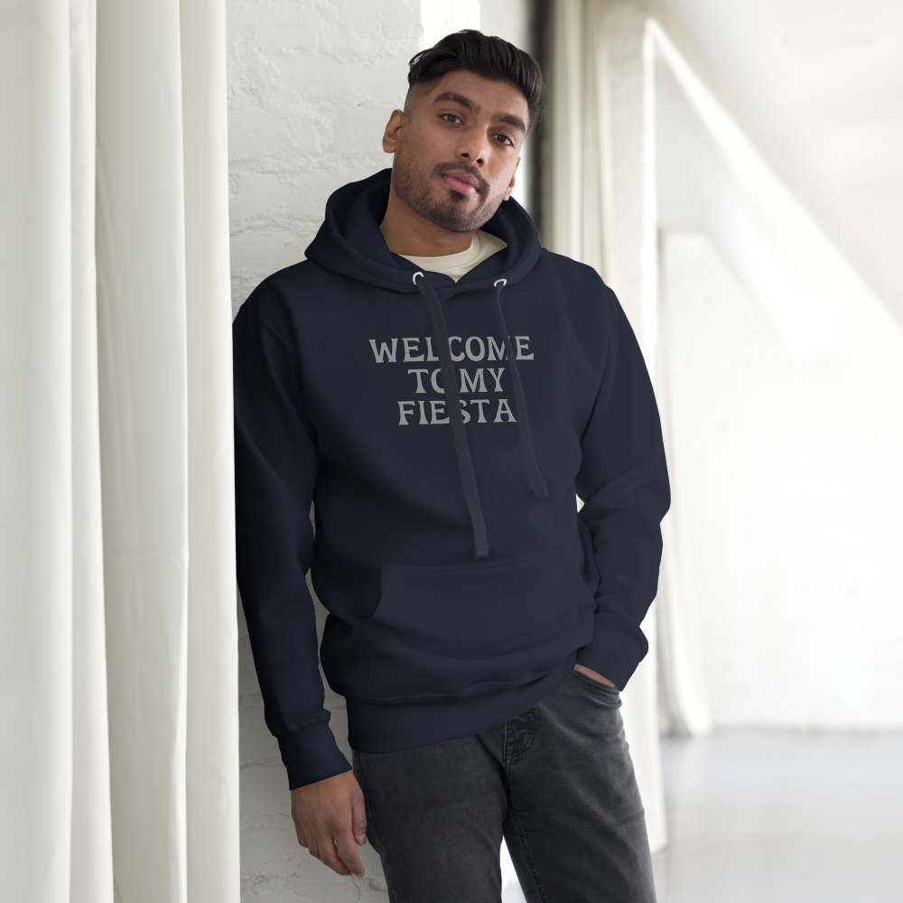 "Welcome to my fiesta!" printed on a navy blazer unisex hoodie worn by a male