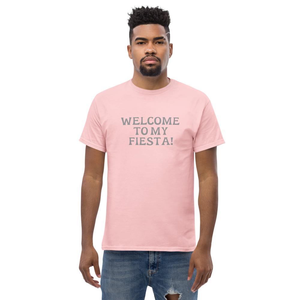 "Welcome to my fiesta!" printed on a light pink unisex classic tee worn by a male