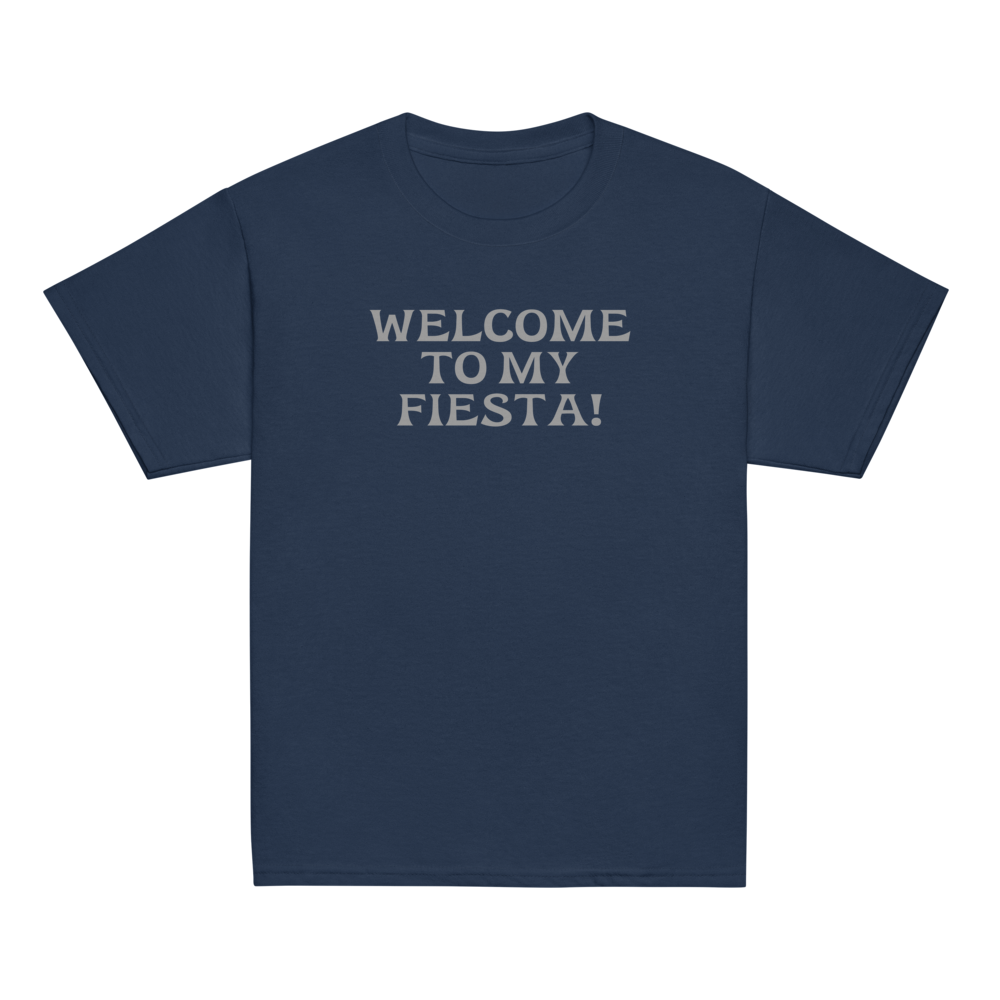"Welcome to my fiesta!" printed on a navy youth classic tee laying on a flat surface