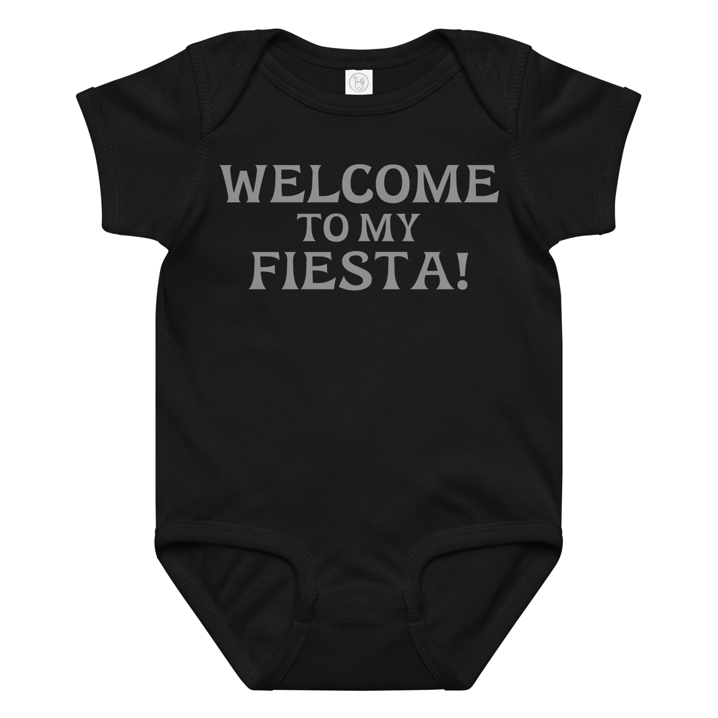 "Welcome to my fiesta!" printed on a black baby jersey bodysuit laying on a flat surface amongst other clothes