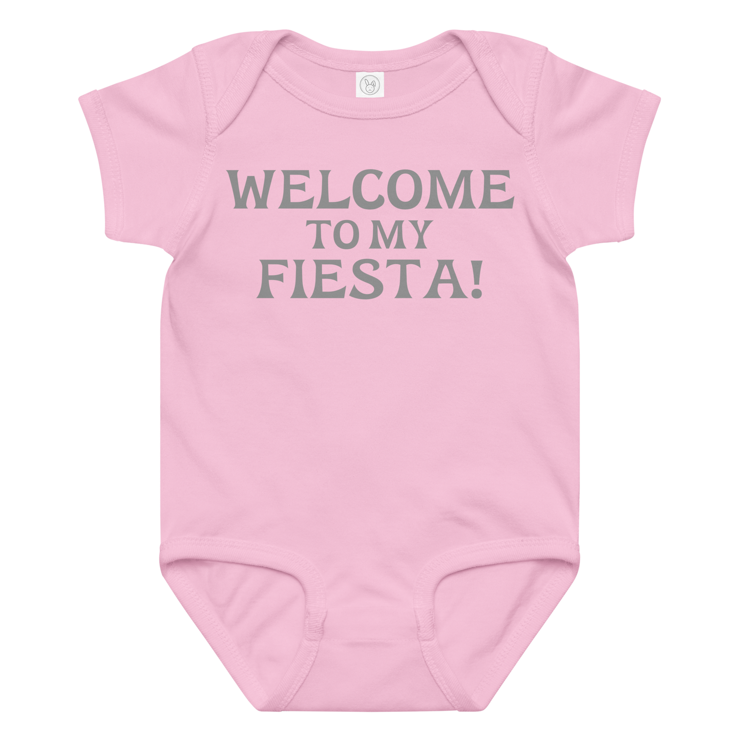 "Welcome to my fiesta!" printed on a pink baby jersey bodysuit laying on a flat surface amongst other clothes
