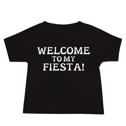 "Welcome to my fiesta!" printed on a black baby jersey short sleeve tee laying on a flat surface