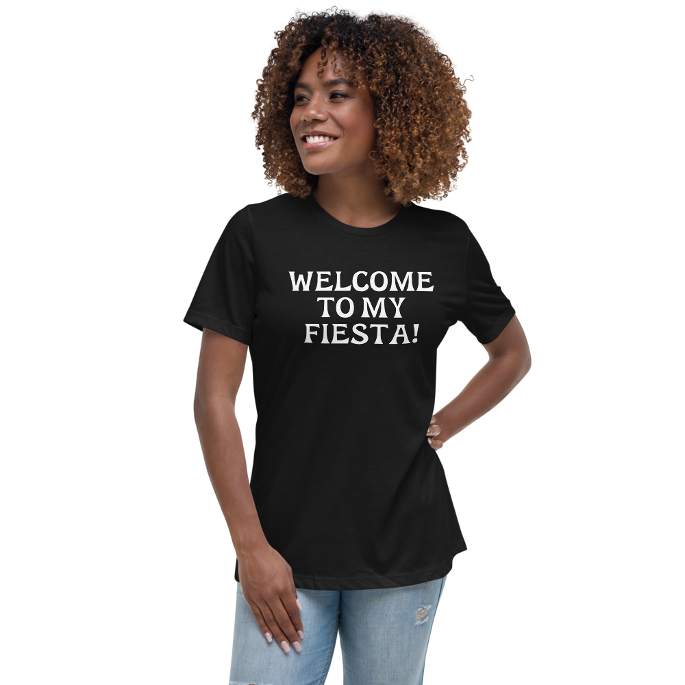 "Welcome to my fiesta!" printed on a black women's relaxed t-shirt worn by a female