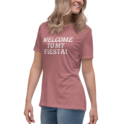 "Welcome to my fiesta!" printed on a heather mauve women's relaxed t-shirt worn by a female