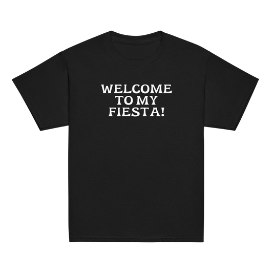 "Welcome to my fiesta!" printed on a black youth classic tee laying on a flat surface