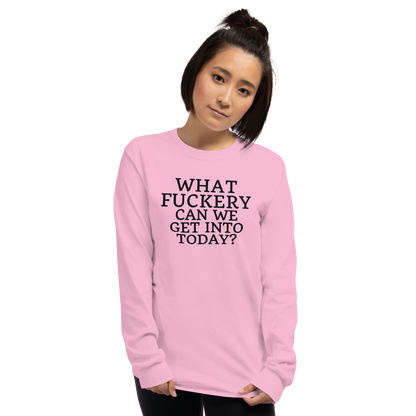 "What fuckery can we get into today?" printed on a light pink men's long sleeve shirt worn by a female