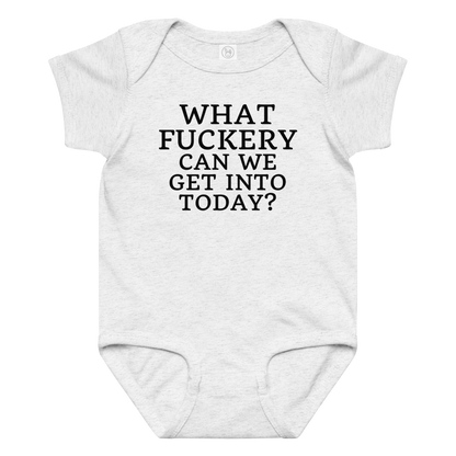 "What fuckery can we get into today?" printed on a ash baby jersey bodysuit laying on a flat surface amongst other clothes