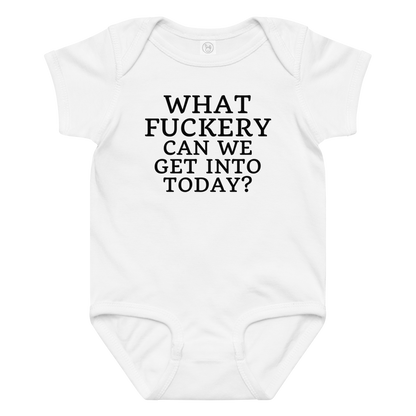 "What fuckery can we get into today?" printed on a white baby jersey bodysuit laying on a flat surface amongst other clothes