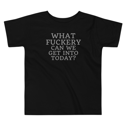 "What fuckery can we get into today?" printed on a black toddler short sleeve tee laying on a flat surface