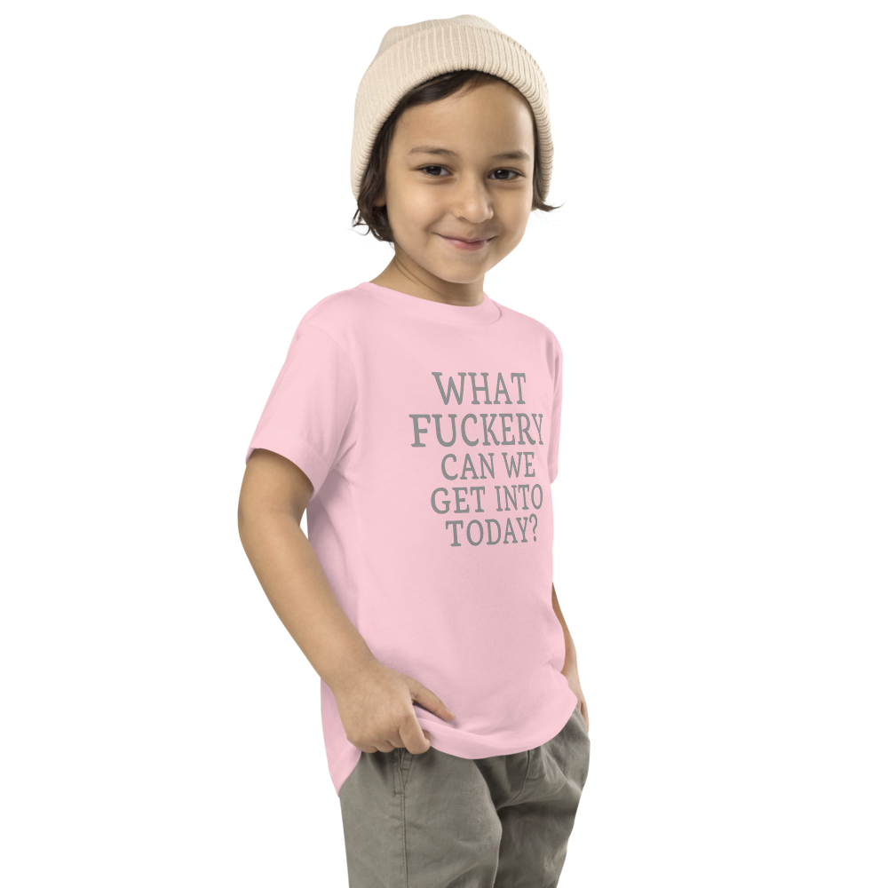 "What fuckery can we get into today?" printed on a pink toddler short sleeve tee worn by a male who is also wearing a knit cap