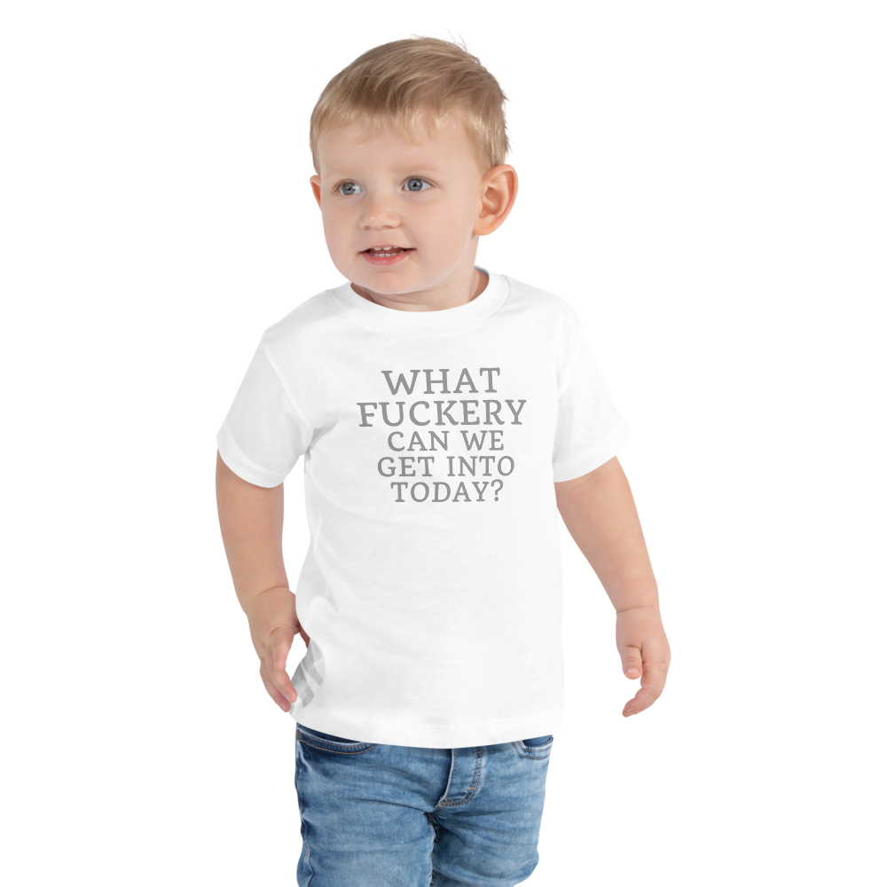 "What fuckery can we get into today?" printed on a white toddler short sleeve tee worn by a male