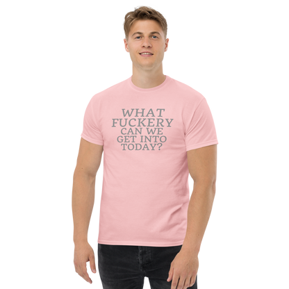 "What fuckery can we get into today?" printed on a light pink unisex classic tee worn by a male