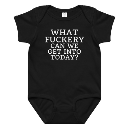 "What fuckery can we get into today?" printed on a black baby jersey bodysuit laying on a flat surface amongst other clothes