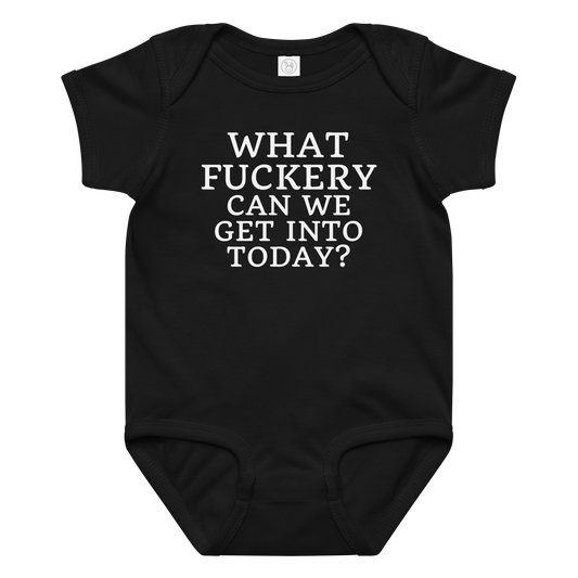 "What fuckery can we get into today?" printed on a black baby jersey bodysuit laying on a flat surface amongst other clothes
