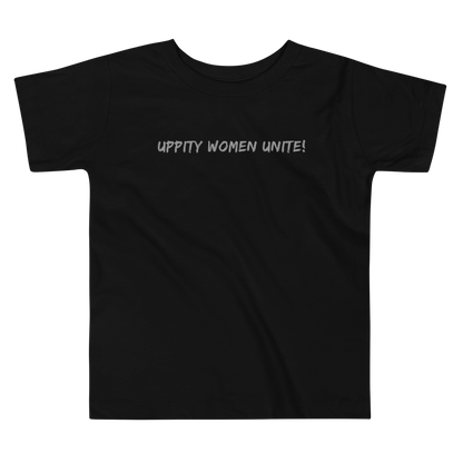 "Uppity Women Unite" printed on a black toddler short sleeve tee laying on a flat surface