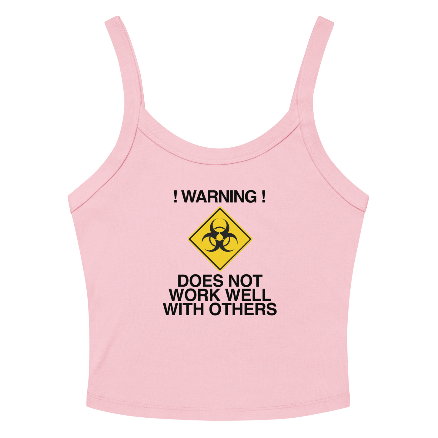 "!Warning! Does Not Work Well With Others" printed on a solid pink blend women's micro-rib tanktop laying on a flat surface amongst sunglasses and shorts