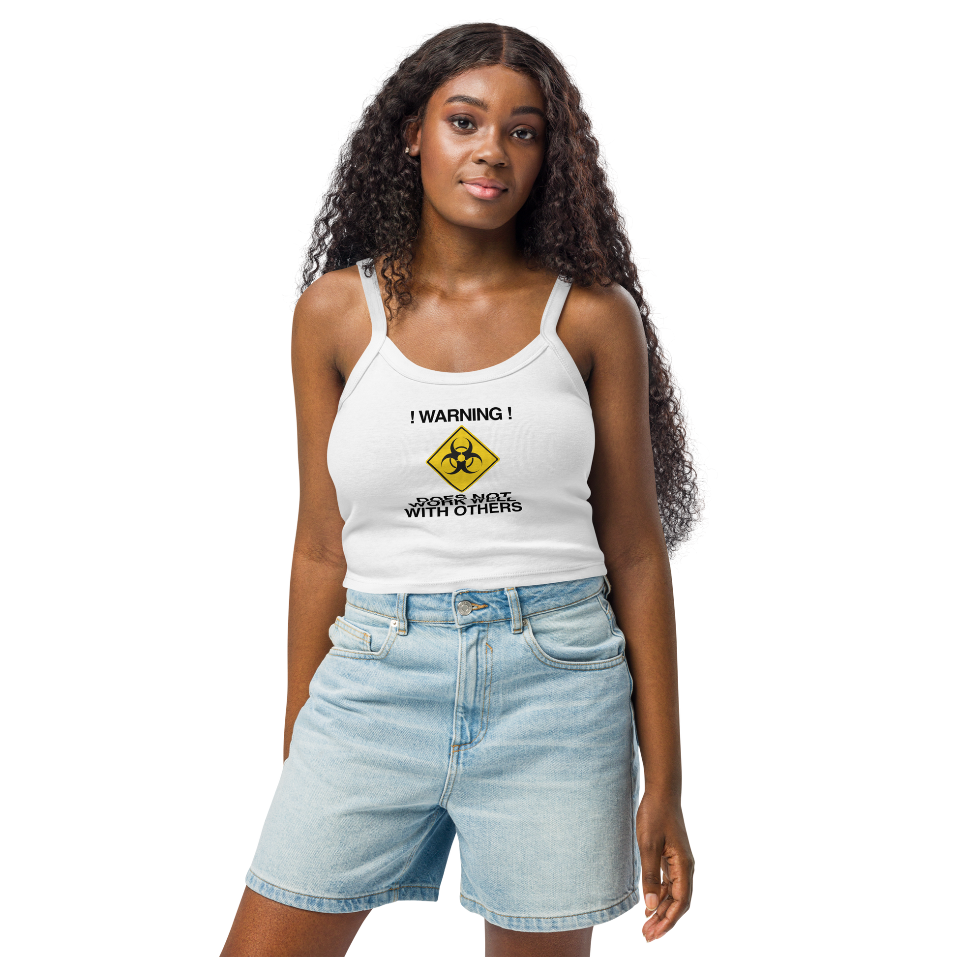 "!Warning! Does Not Work Well With Others" printed on a solid white blend women's micro-rib tanktop worn by a female