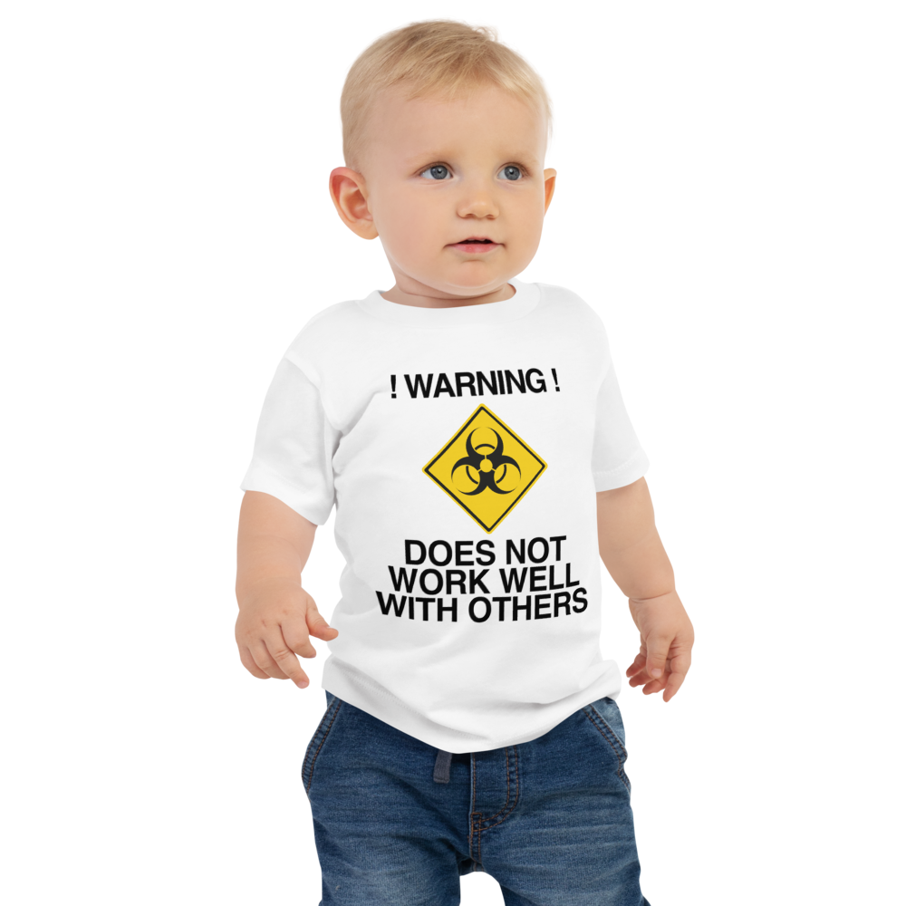 "!Warning! Does Not Work Well With Others" printed on a white baby jersey short sleeve tee worn by a male