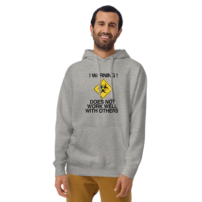 "!Warning! Does Not Work Well With Others" printed on a carbon grey warn by a male