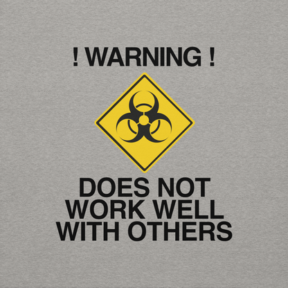 "!Warning! Does Not Work Well With Others" printed on a carbon grey background
