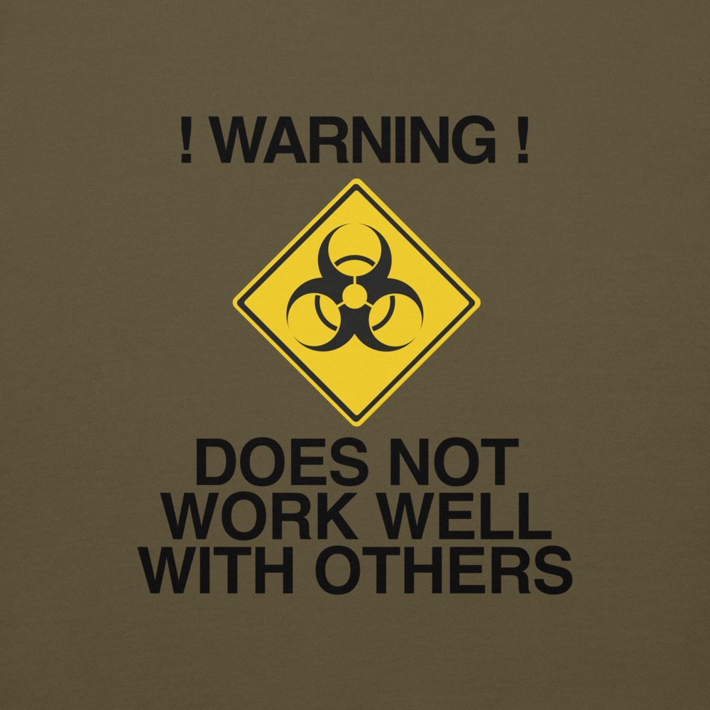 "!Warning! Does Not Work Well With Others" printed on a military green background