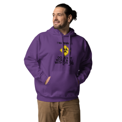"!Warning! Does Not Work Well With Others" printed on a purple unisex hoodie worn by a male