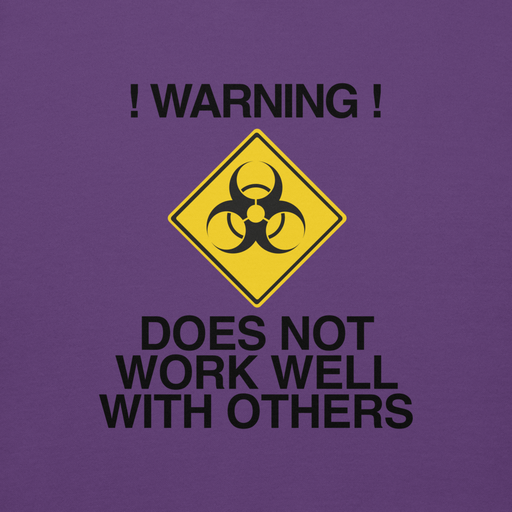 "!Warning! Does Not Work Well With Others" printed on a purple background