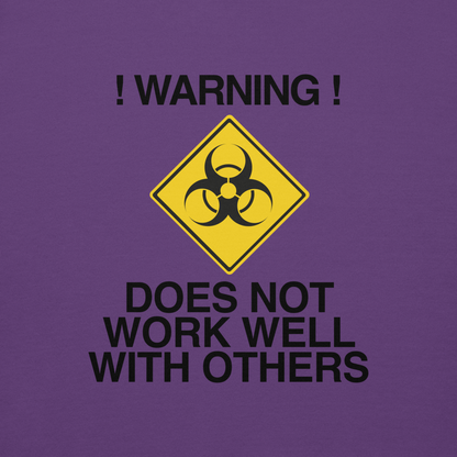 "!Warning! Does Not Work Well With Others" printed on a purple background