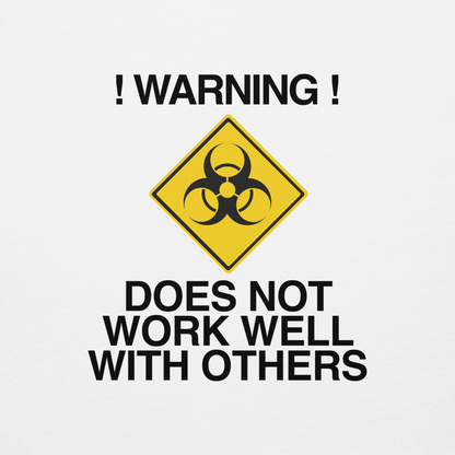 "!Warning! Does Not Work Well With Others" printed on a white background