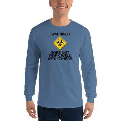 "!Warning! Does Not Work Well With Others" printed on a indigo blue men's long sleeve shirt worn by a male