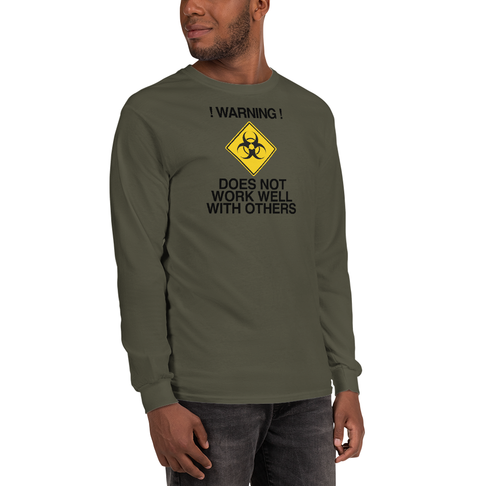 "!Warning! Does Not Work Well With Others" printed on a military green men's long sleeve shirt worn by a male