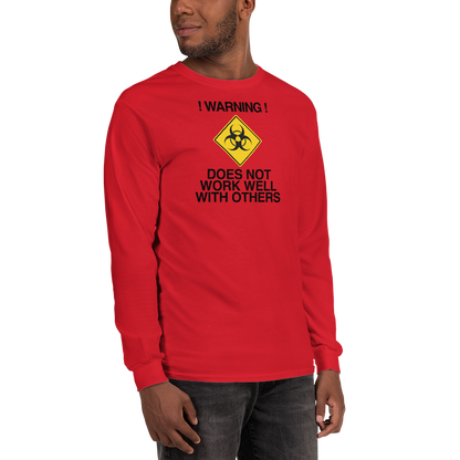 "!Warning! Does Not Work Well With Others" printed on a red men's long sleeve shirt worn by a male