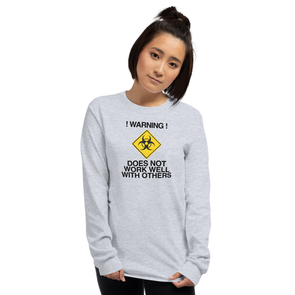 "!Warning! Does Not Work Well With Others" printed on a sport grey men's long sleeve shirt worn by a female
