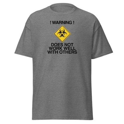 "!Warning! Does Not Work Well With Others" printed on a graphite heather on an invisible body