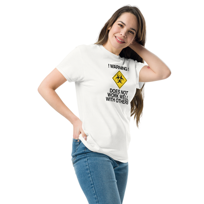 "!Warning! Does Not Work Well With Others" printed on a white unisex classic tee worn by a female