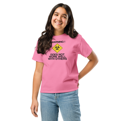 "!Warning! Does Not Work Well With Others" printed on a azalea youth classic tee worn by a female