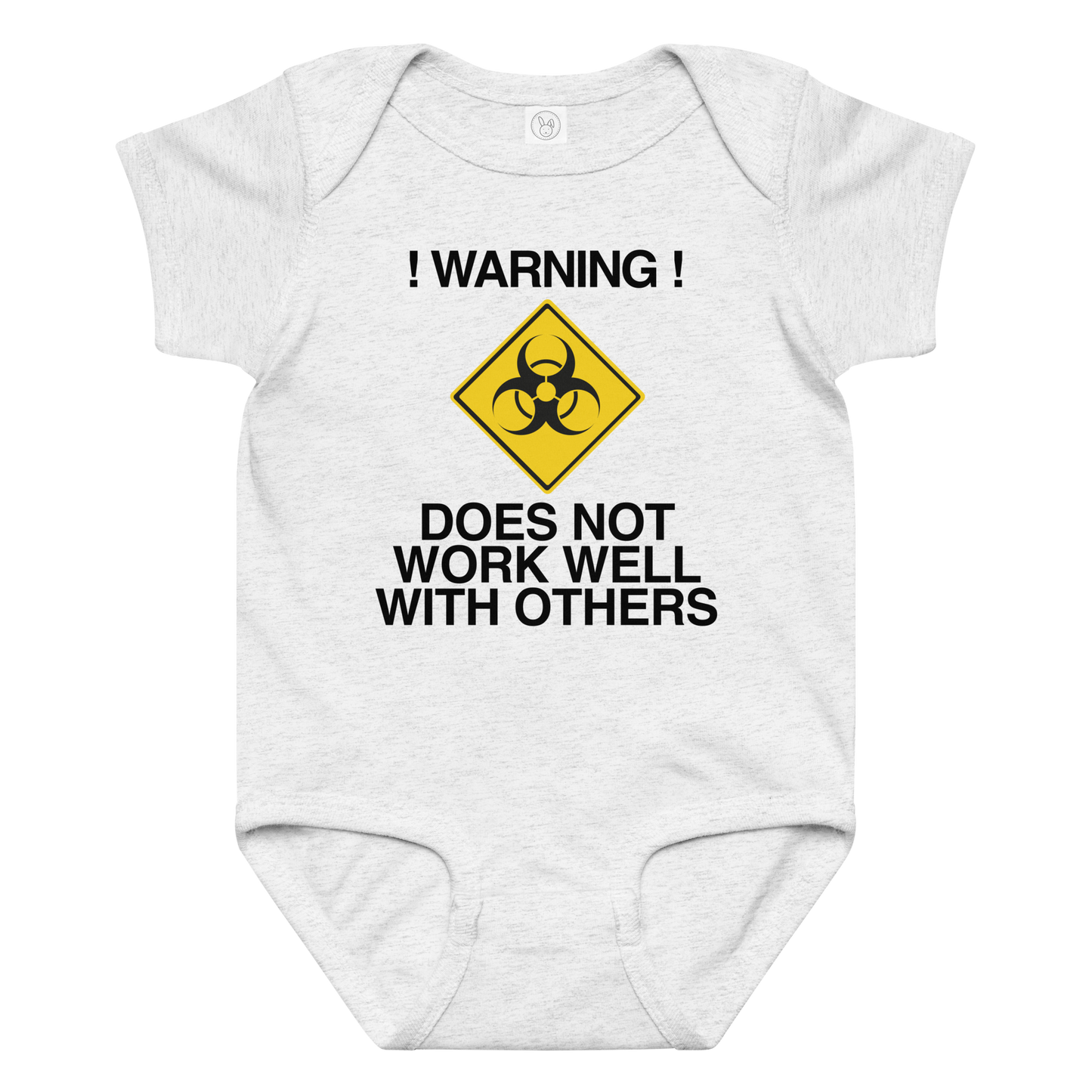 "!Warning! Does Not Work Well With Others" printed on a ash baby jersey bodysuit laying on a flat surface amongst other clothes