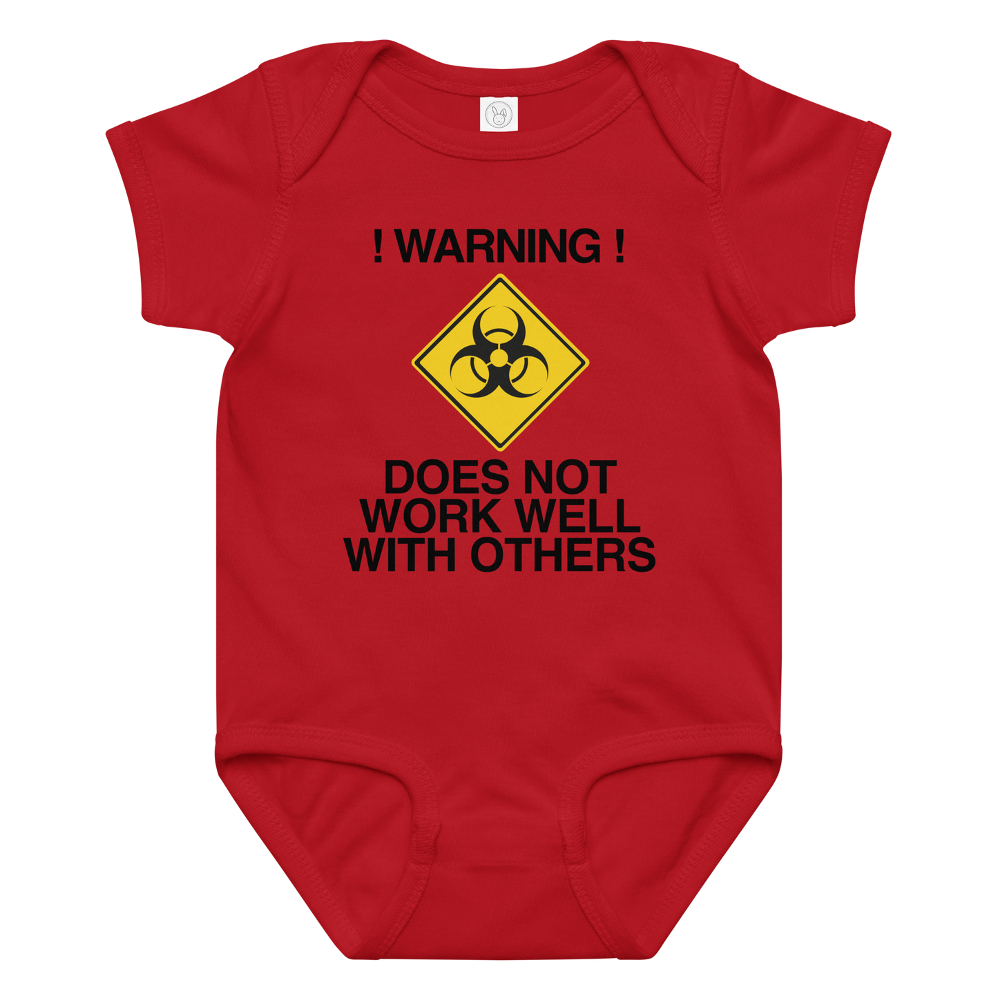 "!Warning! Does Not Work Well With Others" printed on a red baby jersey bodysuit laying on a flat surface amongst other clothes