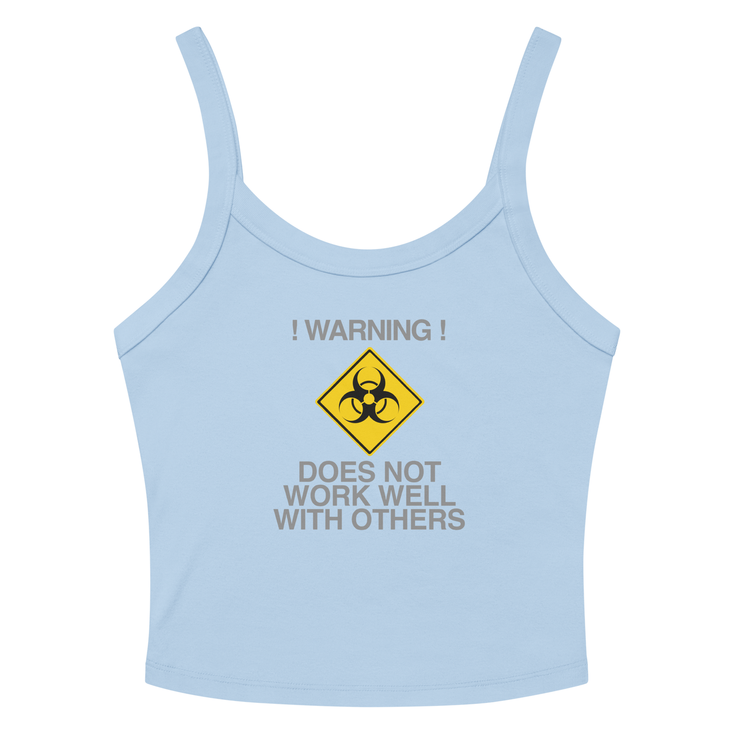 "!Warning! Does Not Work Well With Others" printed on a solid baby blue blend women's micro-rib tanktop laying on a flat surface amongst sunglasses and shorts