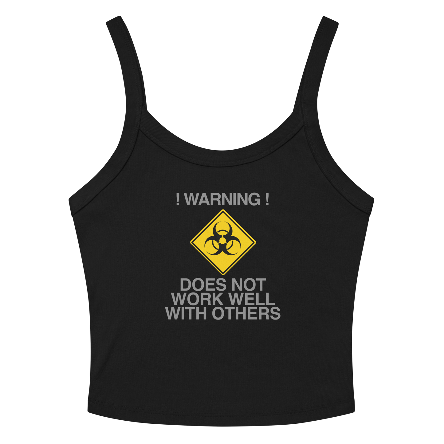 "!Warning! Does Not Work Well With Others" printed on a solid black blend women's micro-rib tanktop laying on a flat surface amongst sunglasses and shorts
