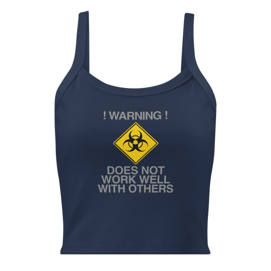 "!Warning! Does Not Work Well With Others" printed on a solid navy blend women's micro-rib tanktop laying on a flat surface