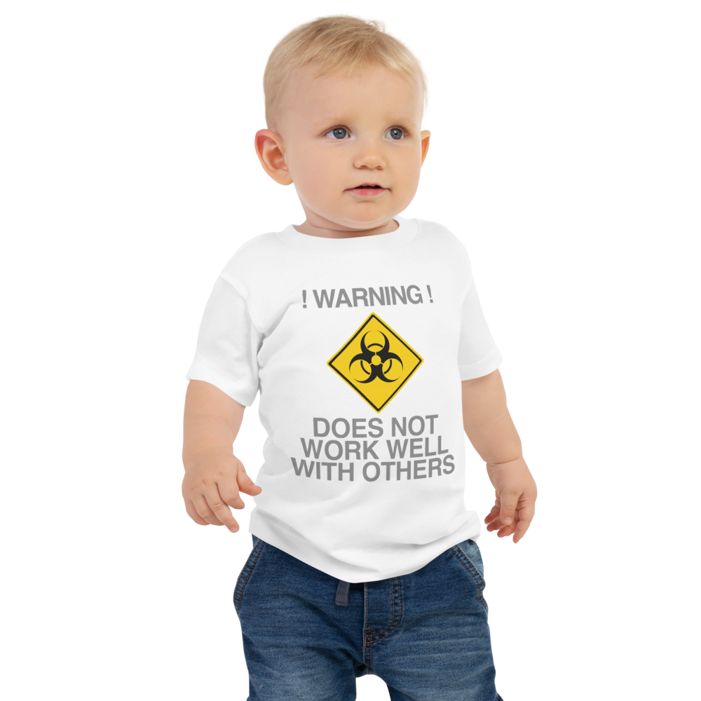 "!Warning! Does Not Work Well With Others" printed on a white baby jersey short sleeve tee worn by a male