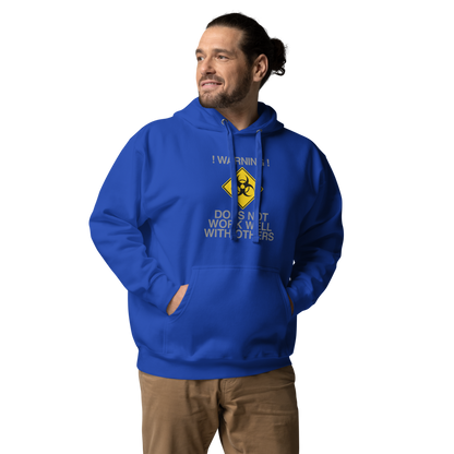 "!Warning! Does Not Work Well With Others" printed on a team royal unisex hoodie worn by a male