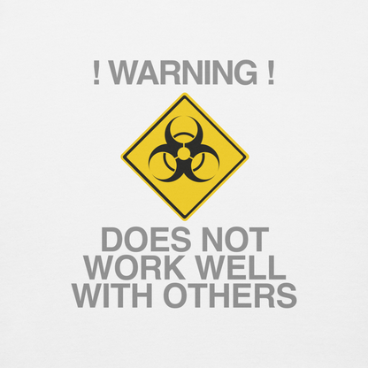 "!Warning! Does Not Work Well With Others" printed on a white background