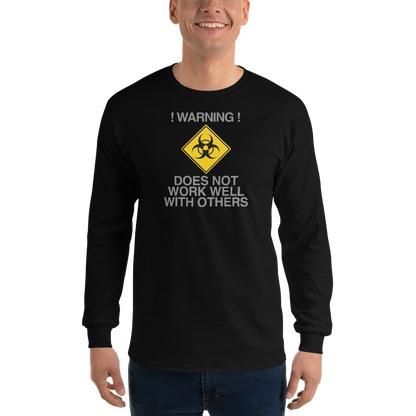 "!Warning! Does Not Work Well With Others" printed on a black men's long sleeve shirt worn by a male