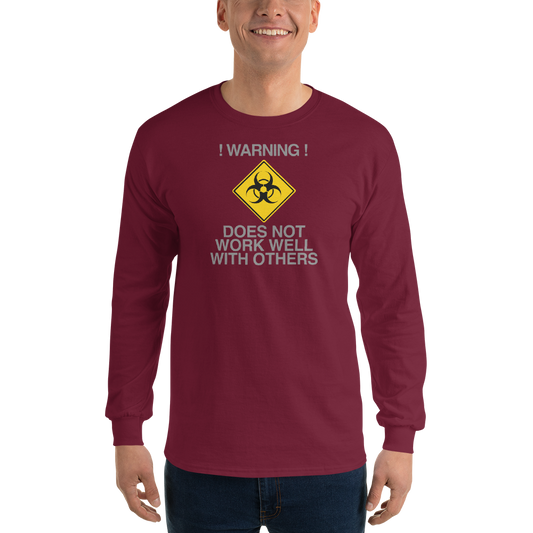 "!Warning! Does Not Work Well With Others" printed on a maroon men's long sleeve shirt worn by a male