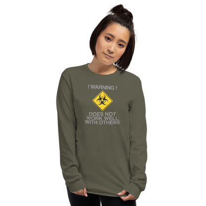 "!Warning! Does Not Work Well With Others" printed on a military green men's long sleeve shirt worn by a female