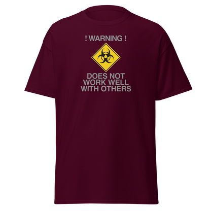 "!Warning! Does Not Work Well With Others" printed on a maroon on an invisible body